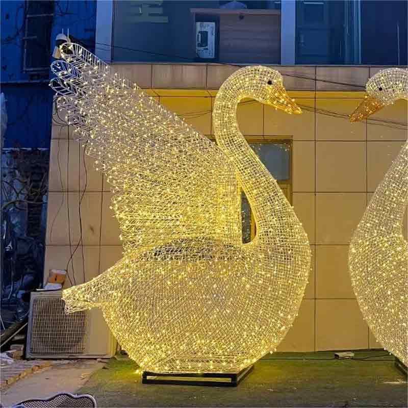 giant LED metal wire swan sculpture, a sculpture of a swan spreading its wings