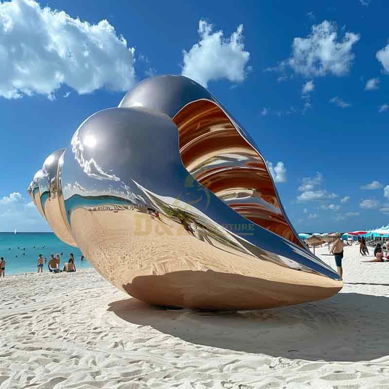 Large abstract metal conch shell sculpture on beach DZ-490