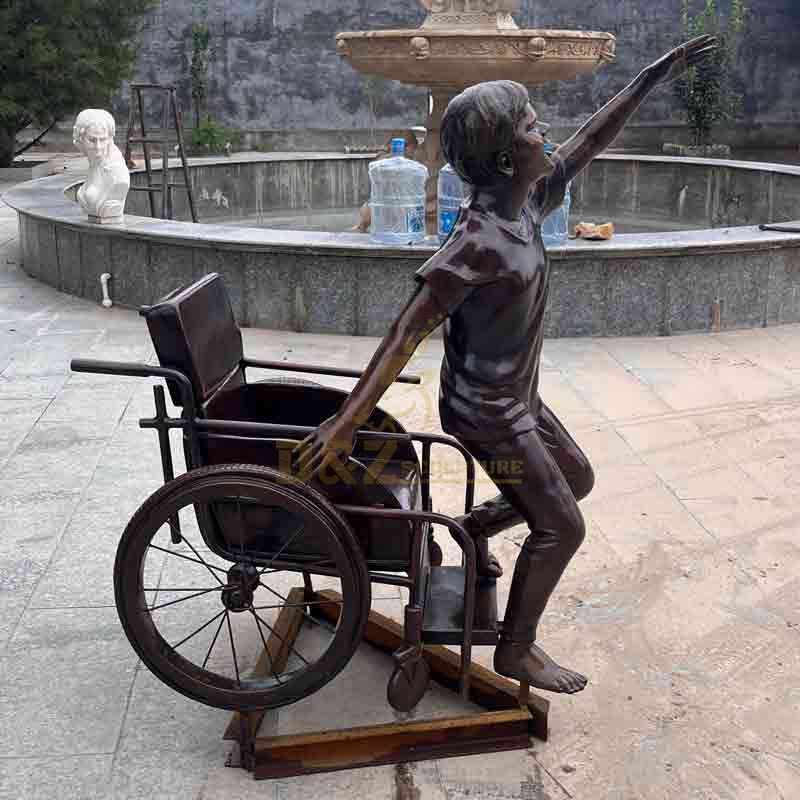 Boy in wheelchair bronze statue custom figure statue DZ-572