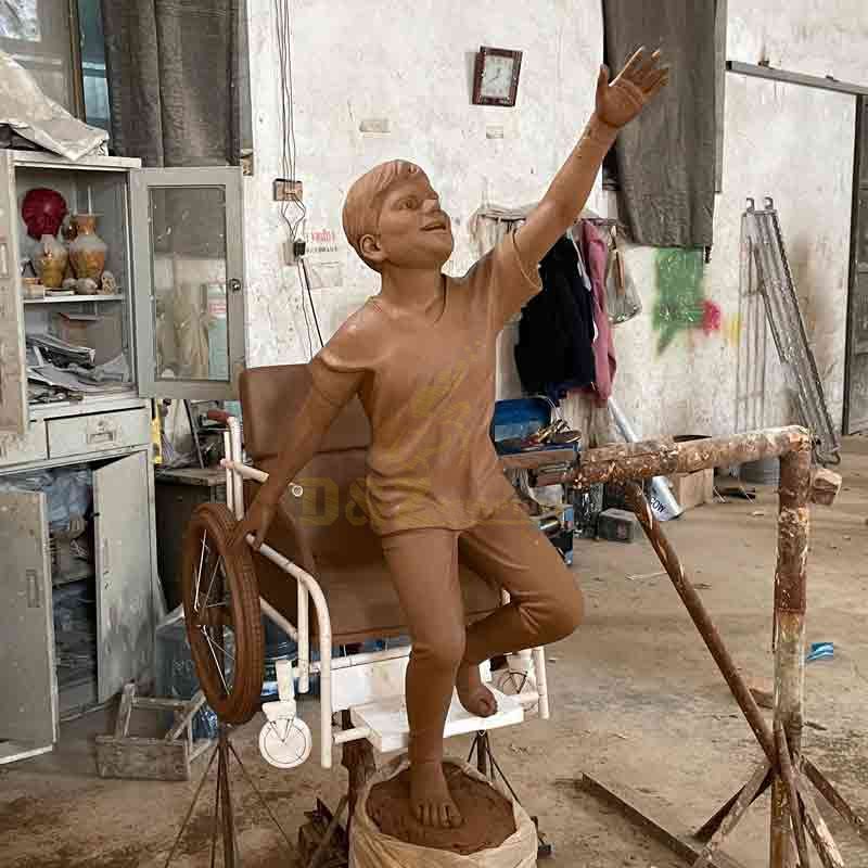 Boy in wheelchair bronze statue custom figure statue DZ-572