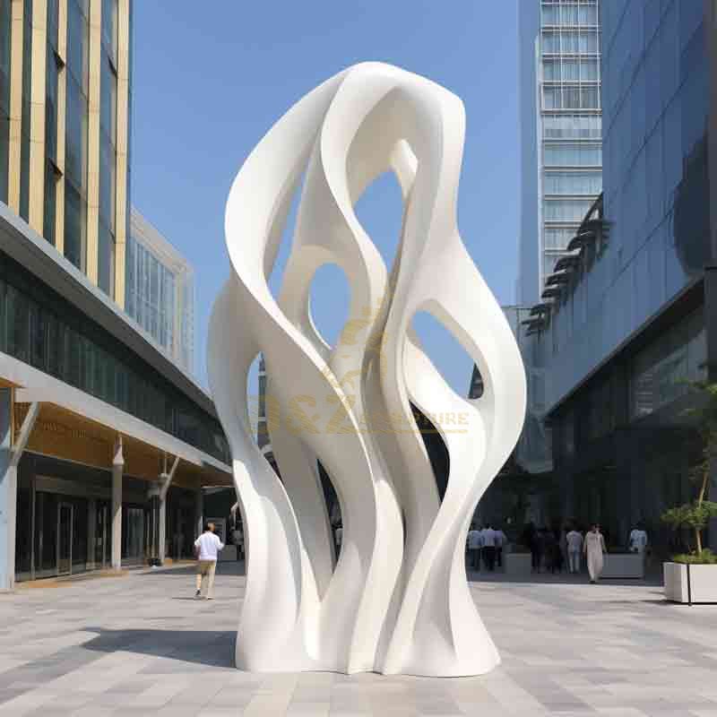 Modern white marble abstract tree sculpture in city commercial district