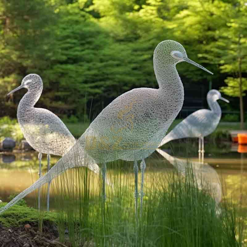 Abstract swan sculpture by the lake in a scenic area