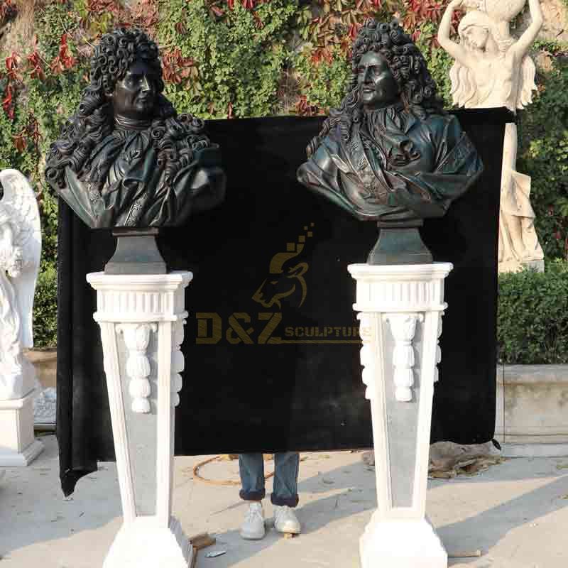 Black bronze bust statues of a man and woman