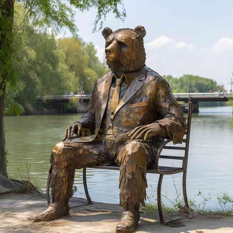 Bronze bear statue - Mr. Bear resting on a bench