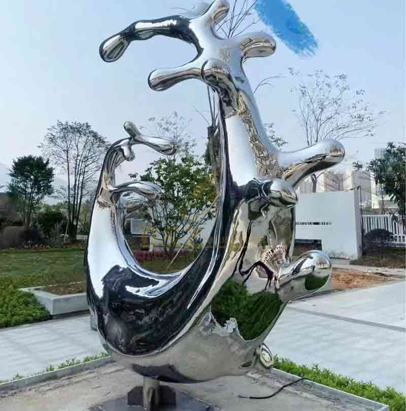 large metal abstract wave sculpture