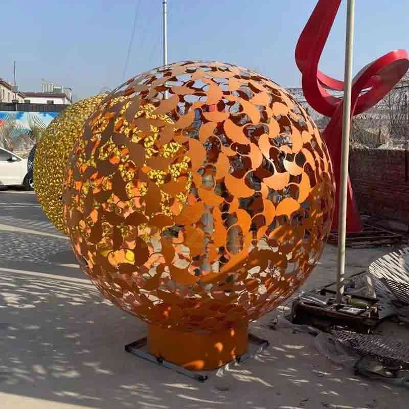 Orange four-leaf clover hollow metal garden sphere sculpture