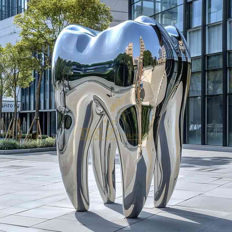 stainless steel giant tooth sculpture