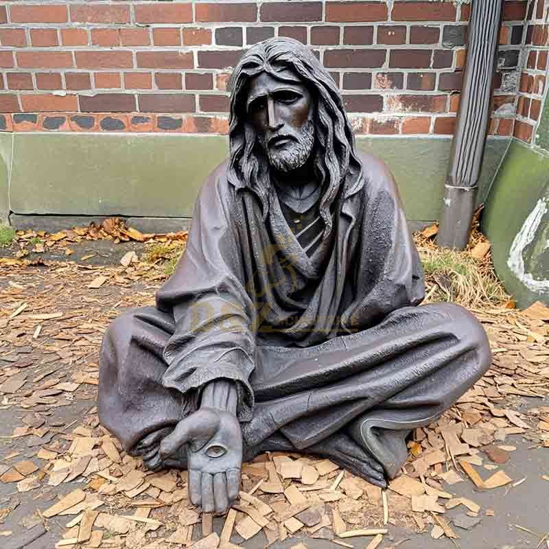 Homeless Jesus statue in the ruins