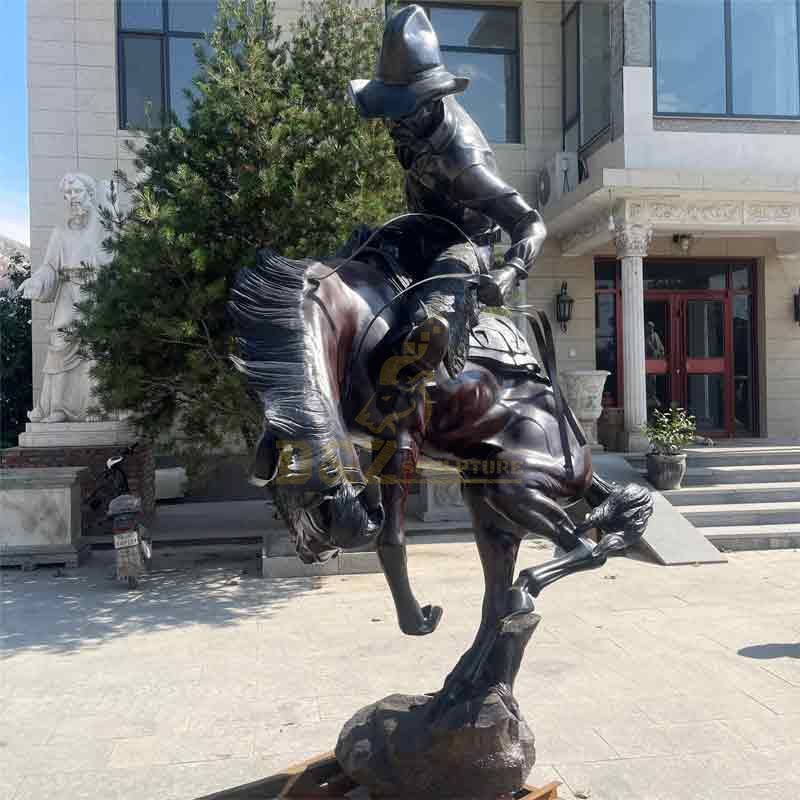 large bronze cowboy on horse statue