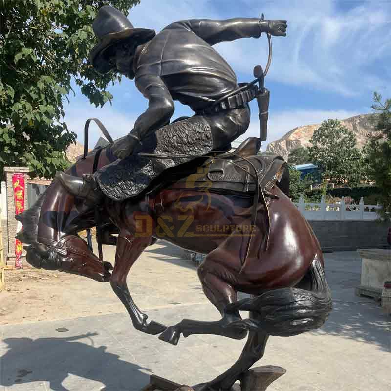 large bronze cowboy on horse statue