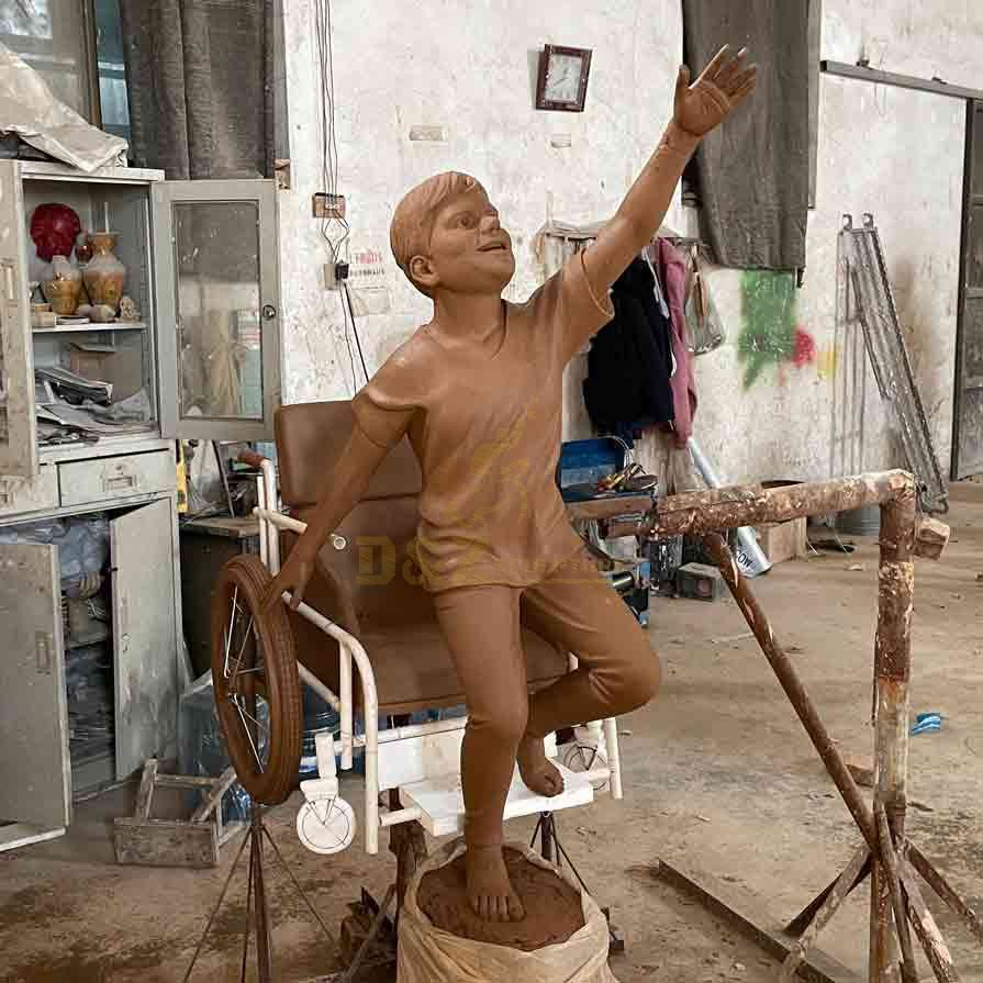 Boy in wheelchair bronze statue custom figure statue DZ-572