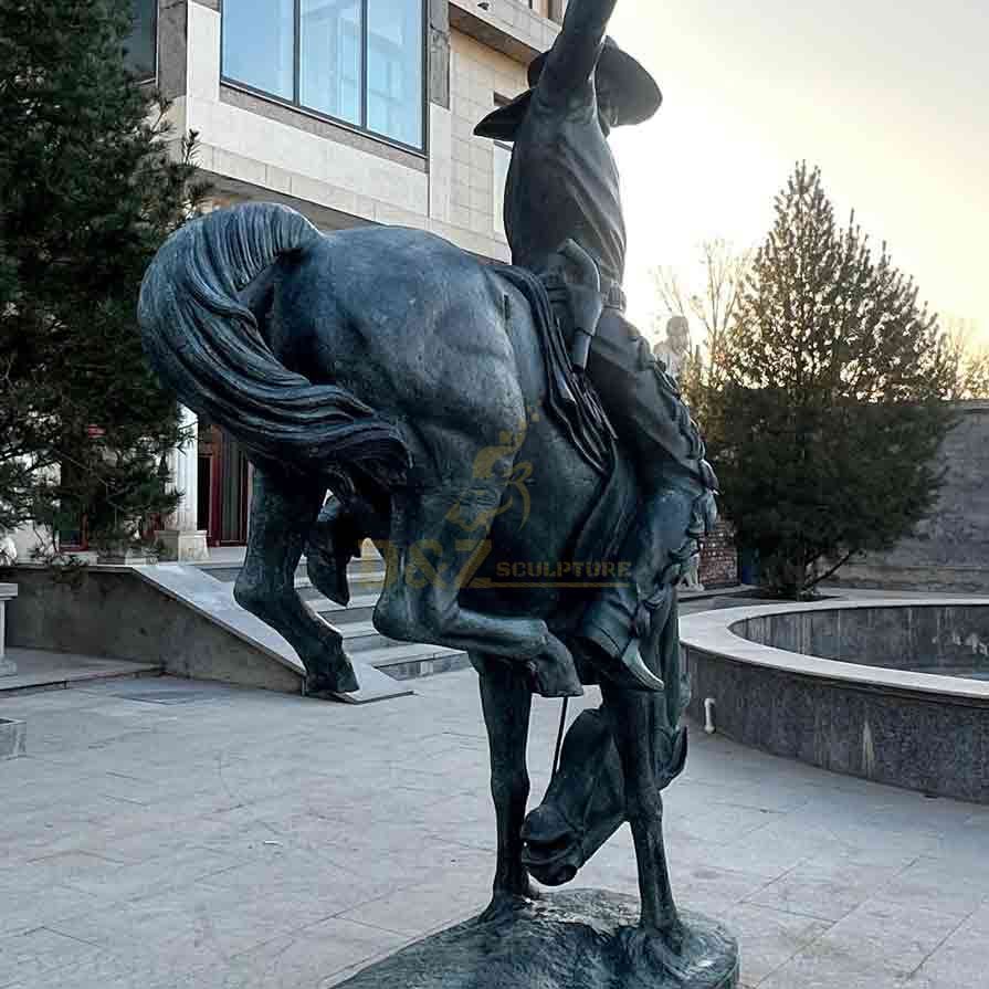 Vintage cowboy on horse statue