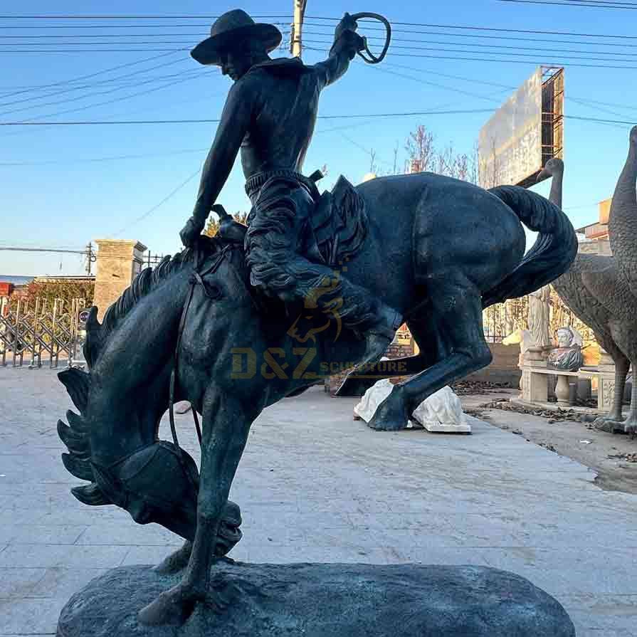 bronze cowboy on horse statue