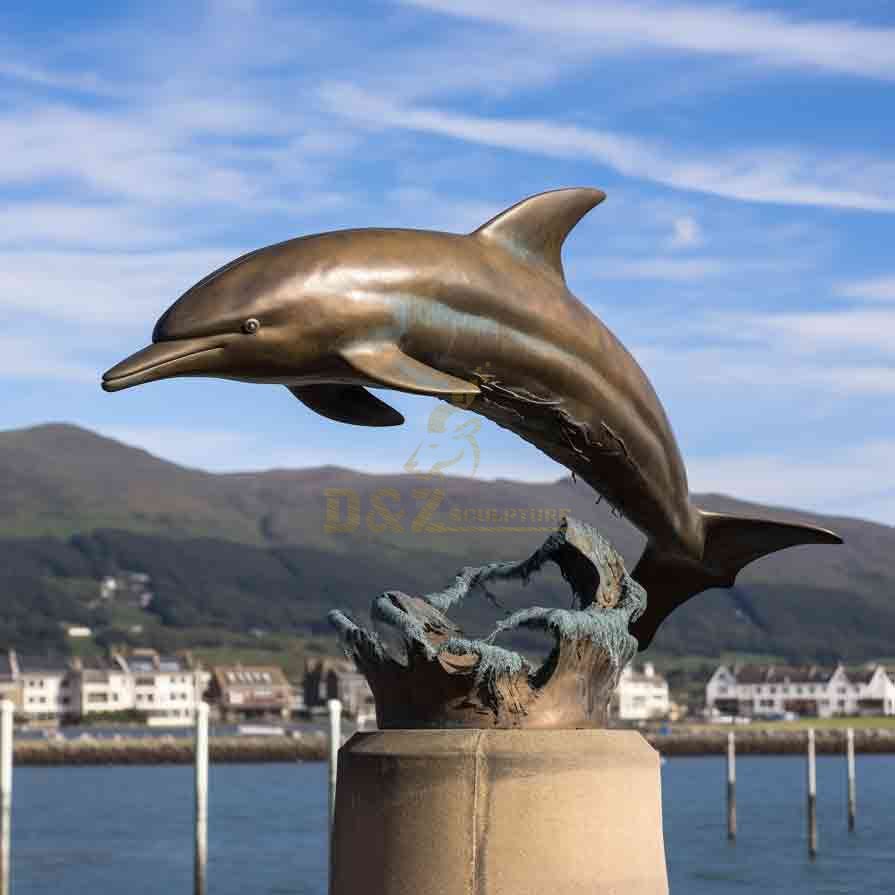 Large outdoor bronze dolphin sculpture jumping out of water