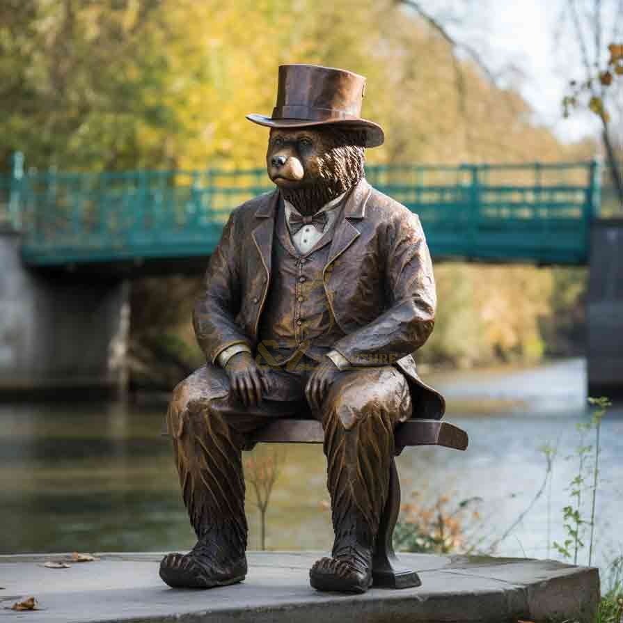 A bronze statue of Mr. Bear wearing a gentleman's hat