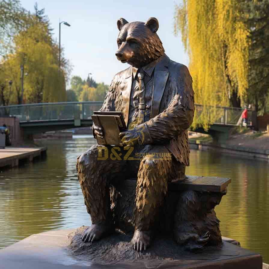 Bronze bear sculpture reading