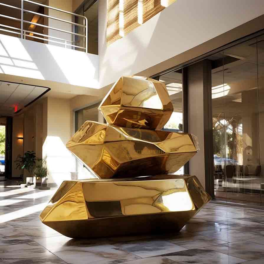 Large gold geometric metal sculpture