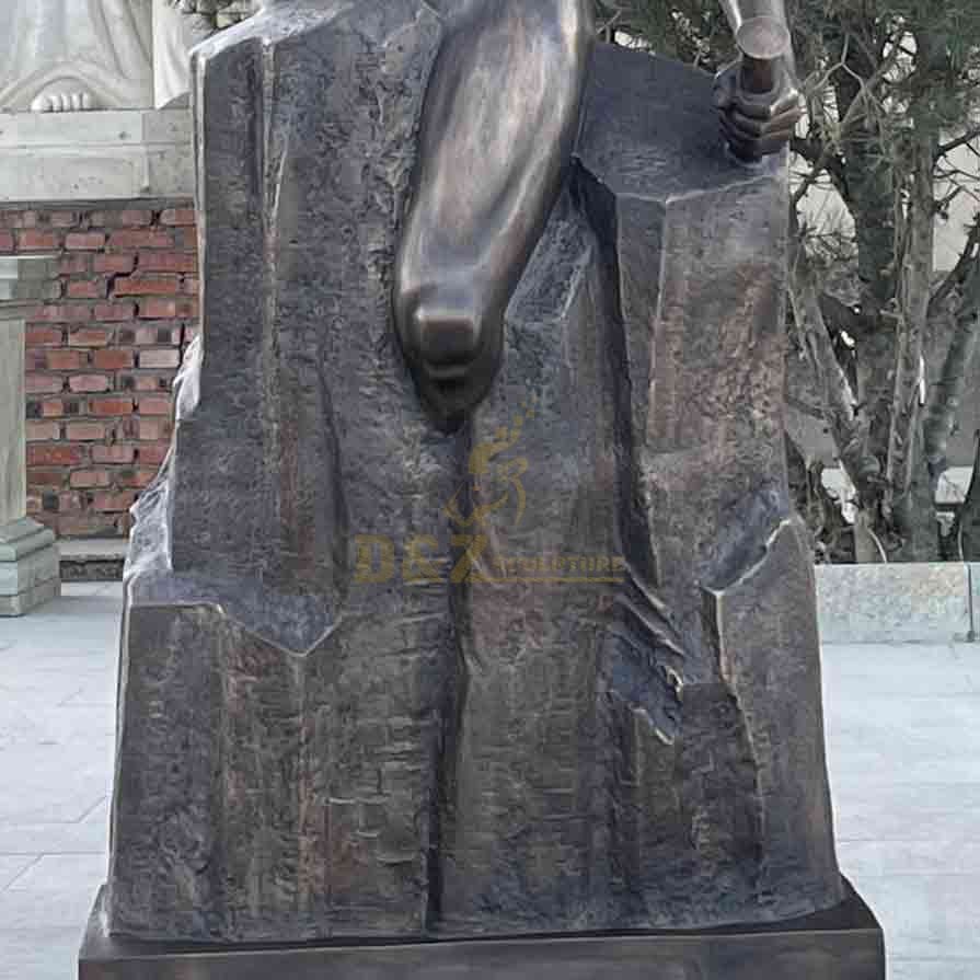 Detail of the legs of the bronze self-made man statue