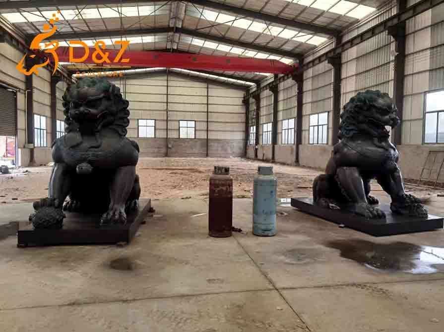 Pair of large bronze lion statues for sale